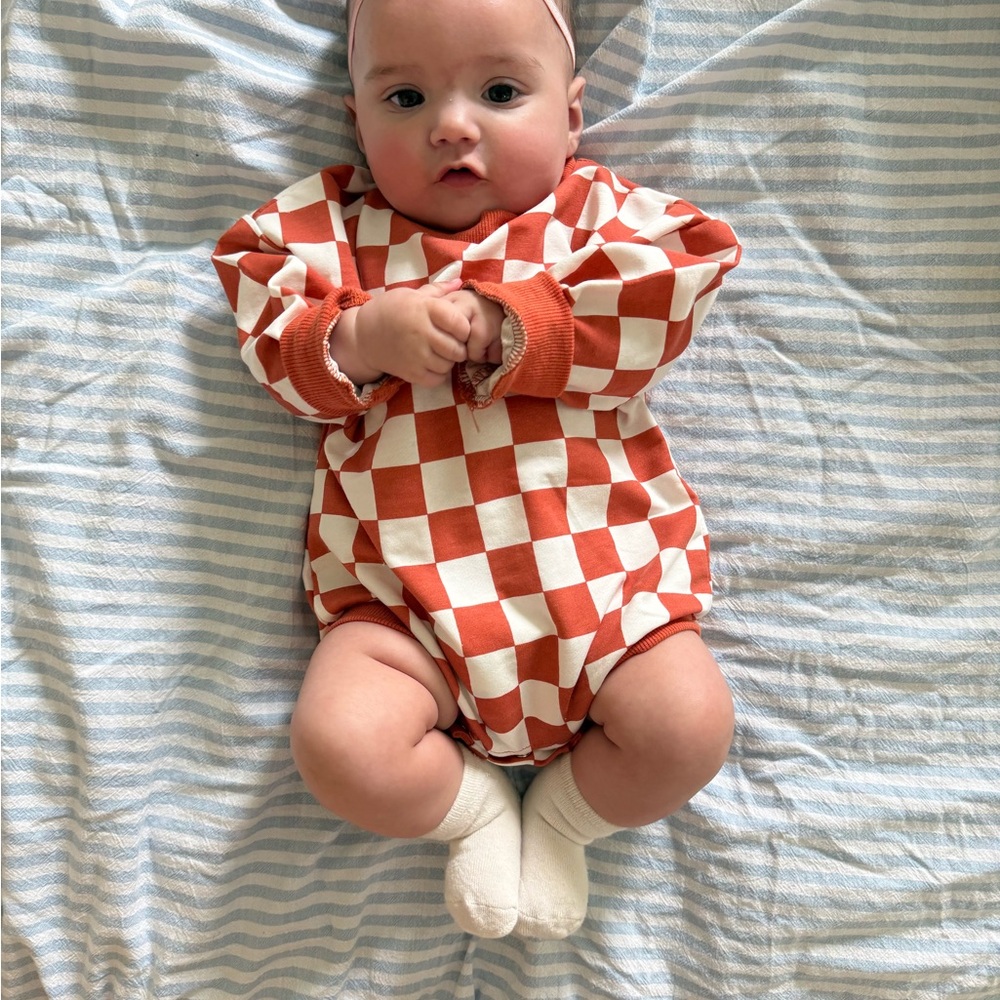 Checkerboard Orange and Cream Baby One-Piece